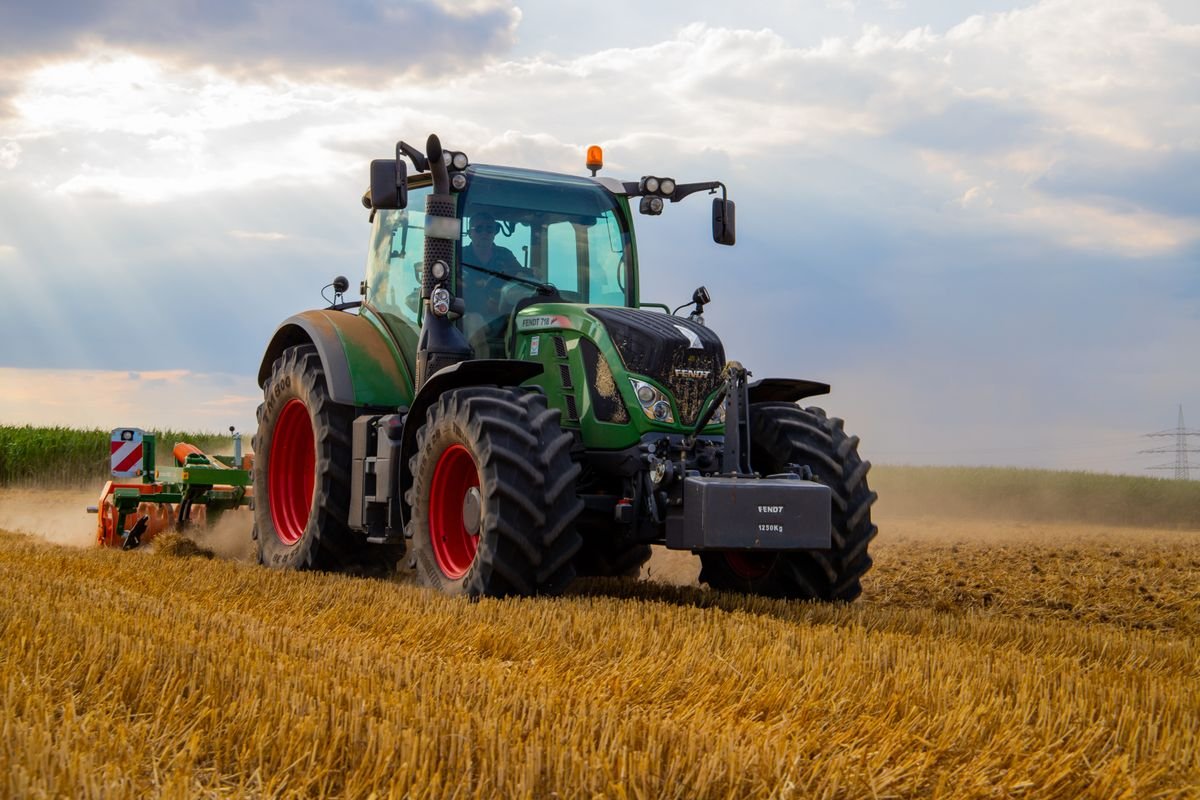 Tractor working a wheat field